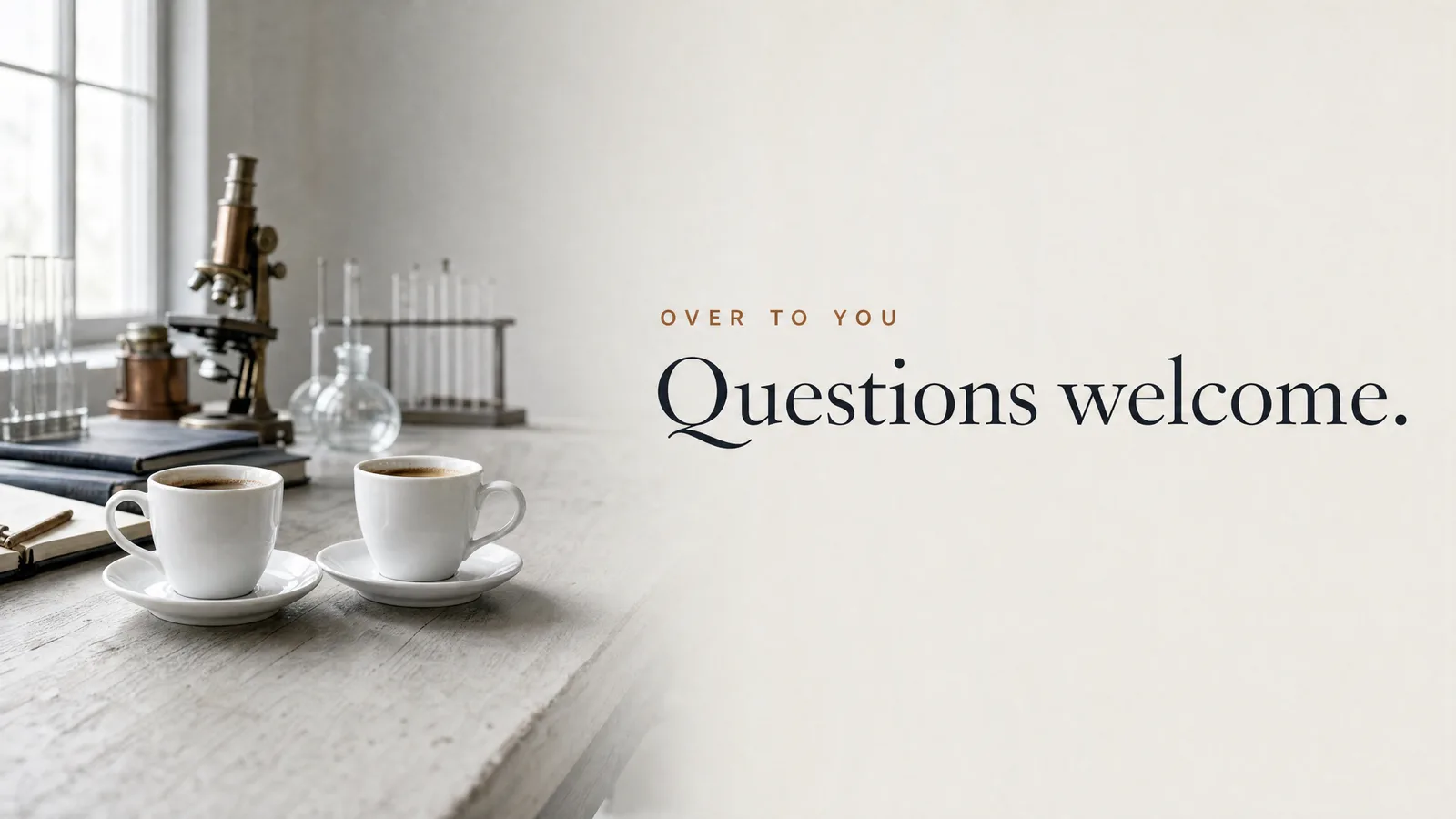 Slide: Over to you — Questions welcome. Two espresso cups beside an antique brass microscope.