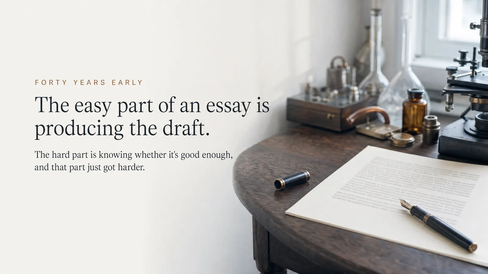 Slide: Forty years early — The easy part of an essay is producing the draft. The hard part is knowing whether it's good enough, and that part just got harder. A handwritten page and fountain pen on an antique desk.